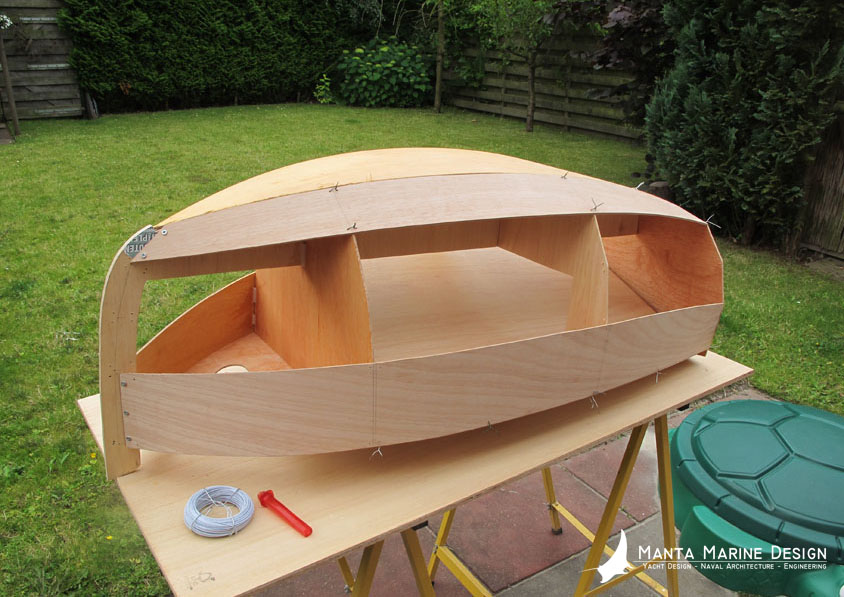 Plans for a easy to build DIY Baby boat cradle. Using the stitch and glue method to bring the parts together with thin wire